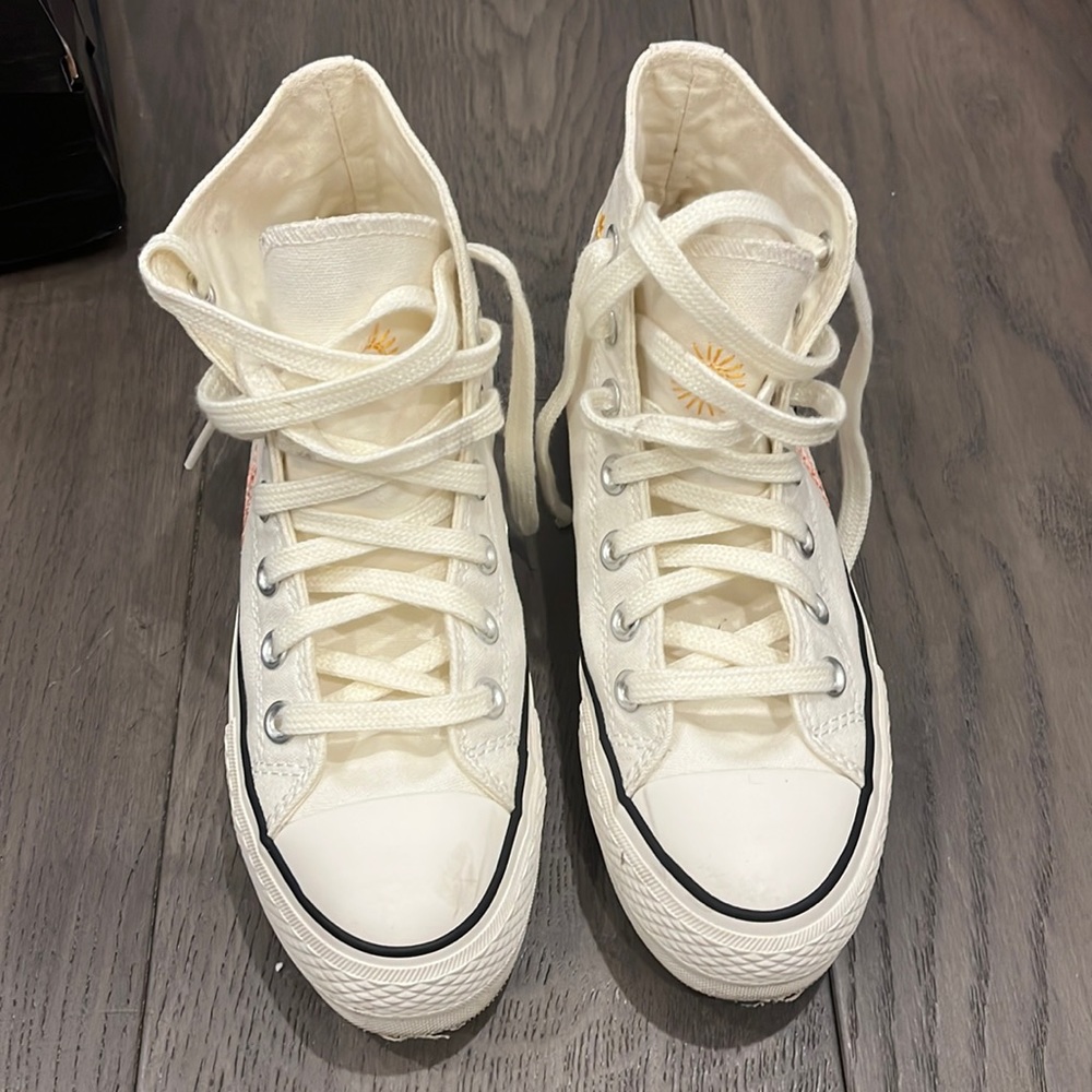 Embroidered white converse